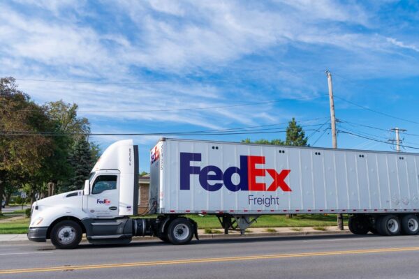Chicago USA August 21 2024 Truck with FedEx container on truck on the road FedEx Corporation a