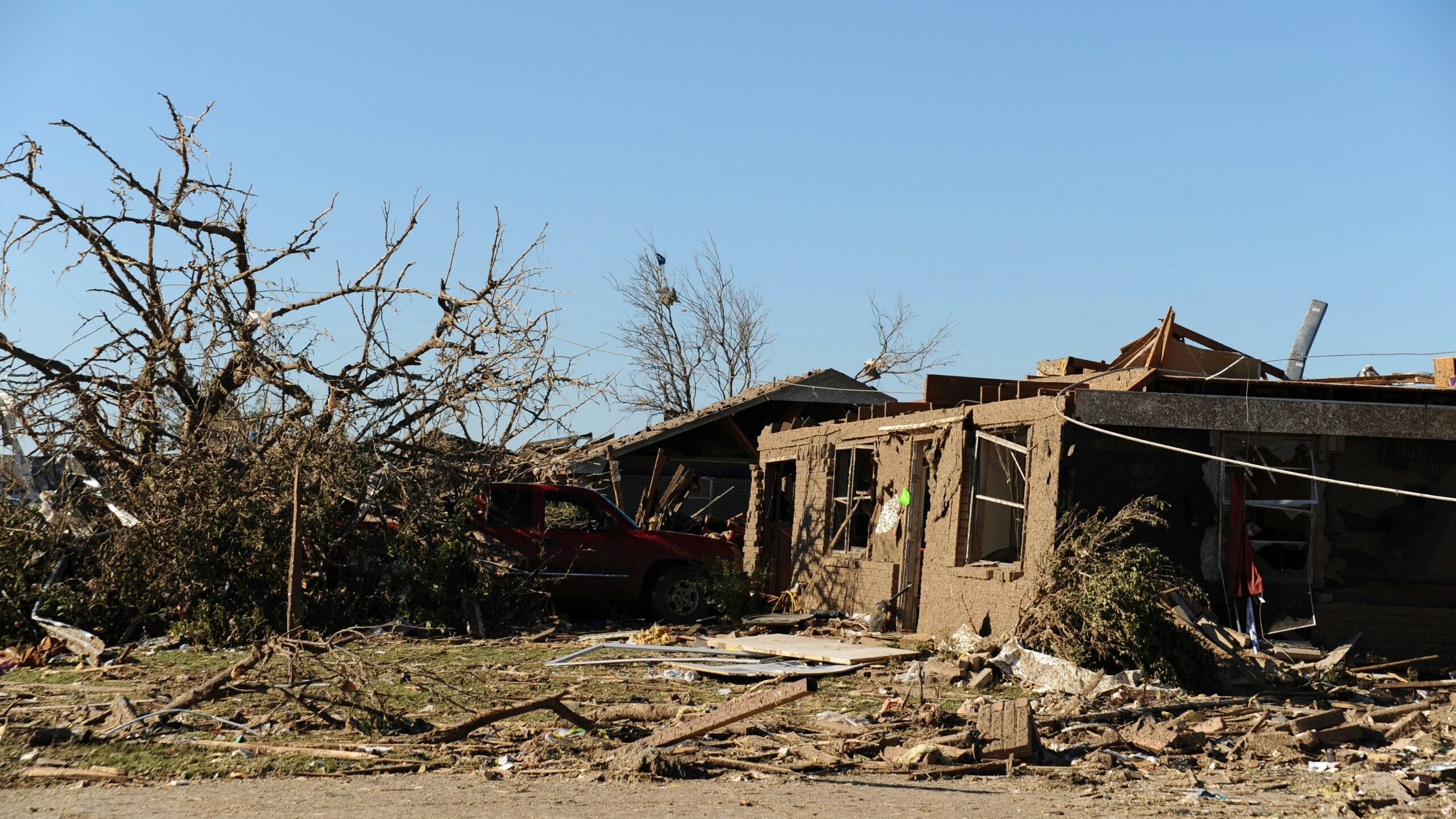 a house that has been destroyed by a tree