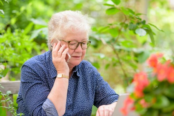 an old woman using a laptop
