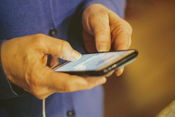 person holding silver iphone 6