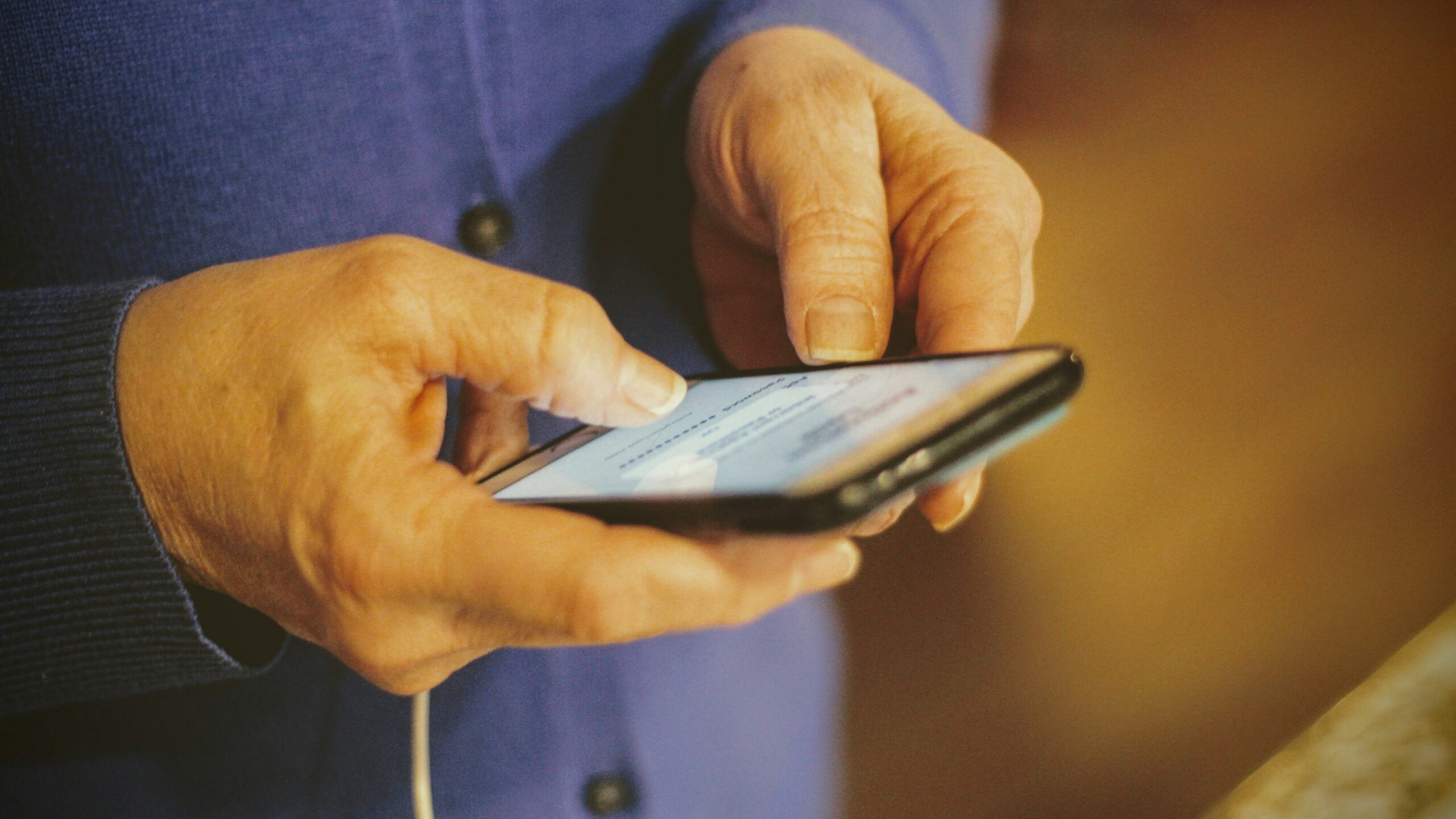 person holding silver iphone 6