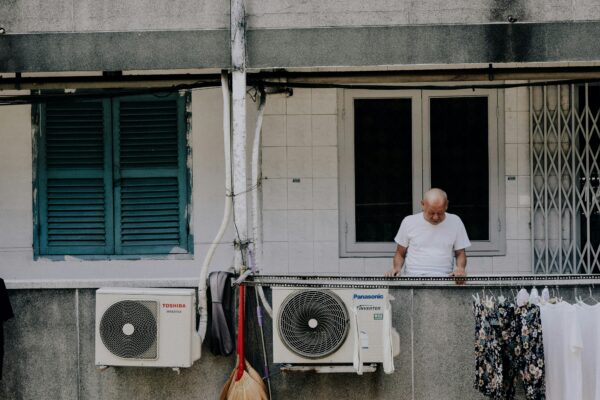 man looking downward at the apartment