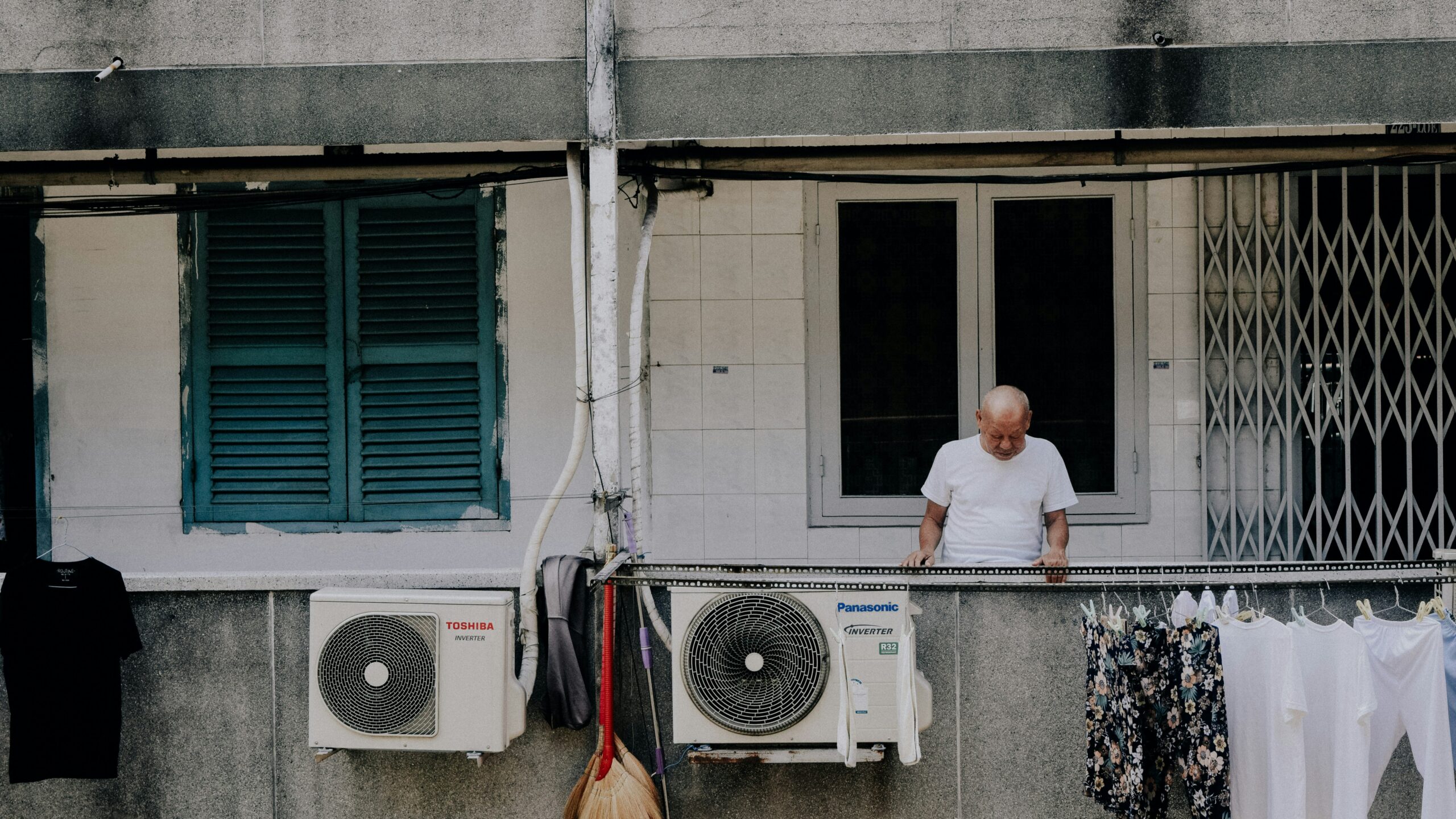 man looking downward at the apartment