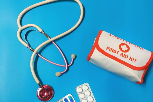 a bag of pills, a stethoscope, and a first aid kit