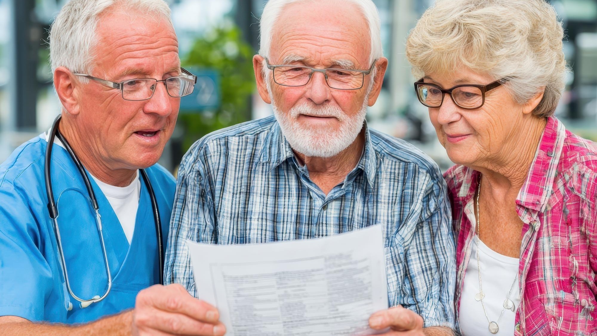 Medical worker showing document to senior couple