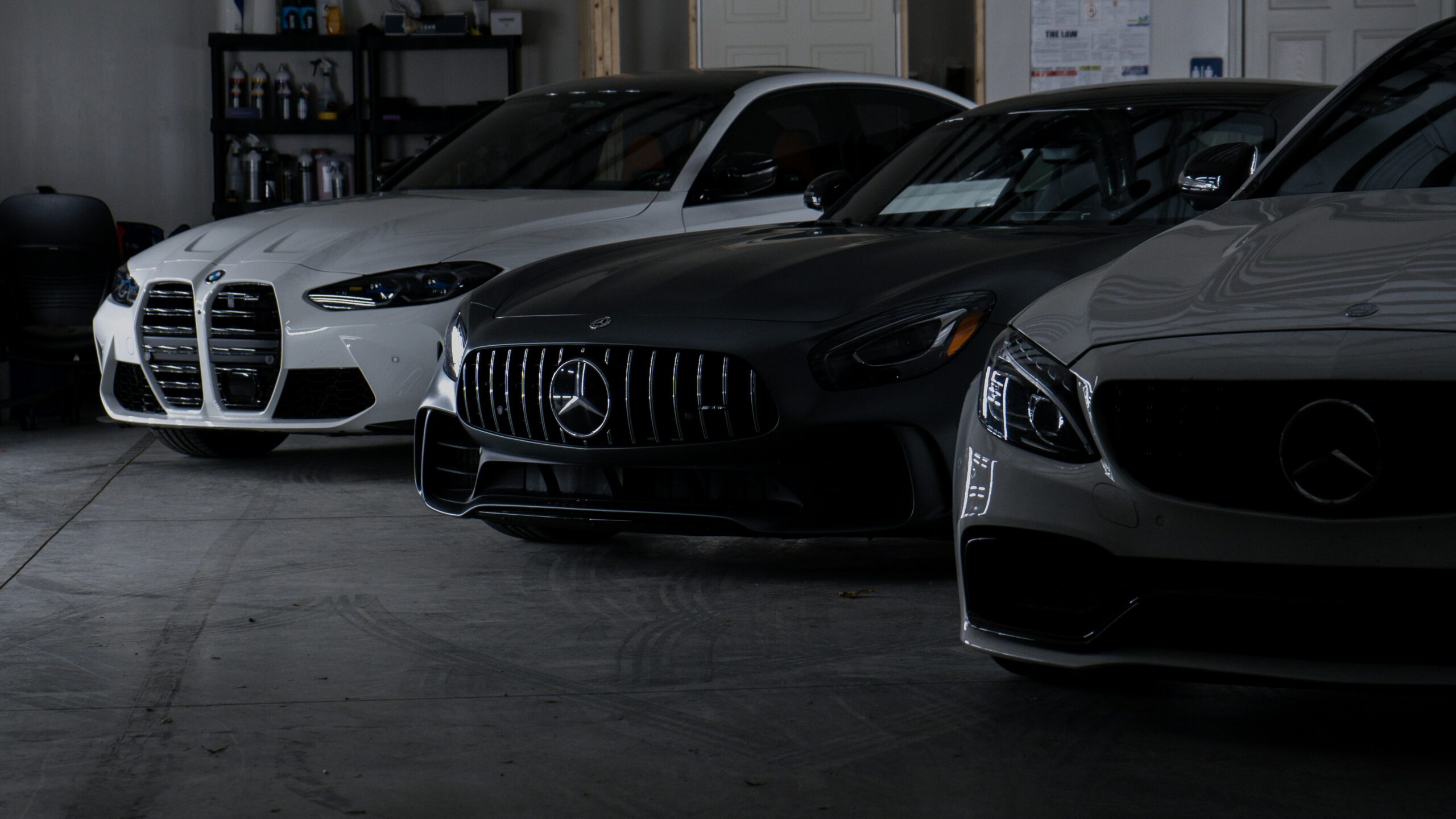 A group of cars parked in a garage