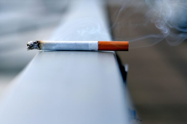 white cigarette stick on white wall