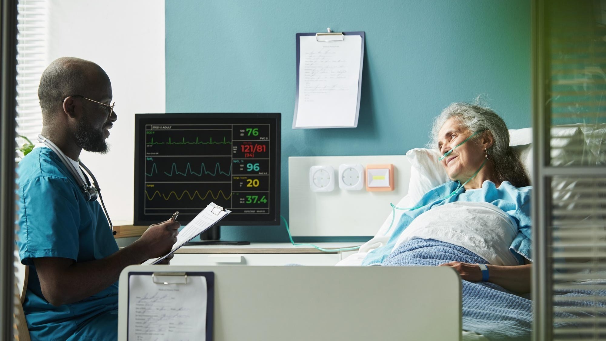 Middle aged black male doctor consulting senior caucasian female patient
