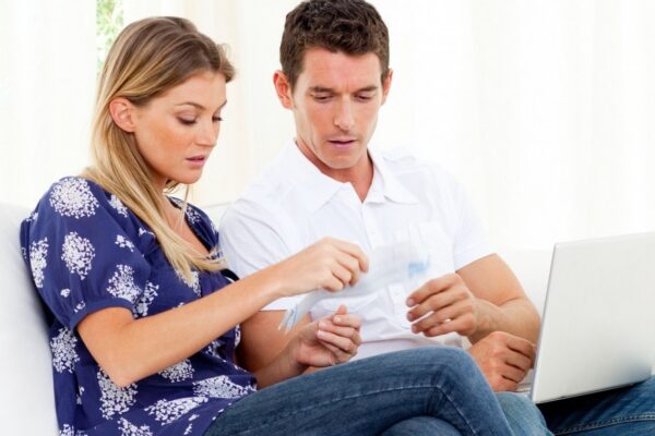 Pessimistic couple stressed with so many bills to pay