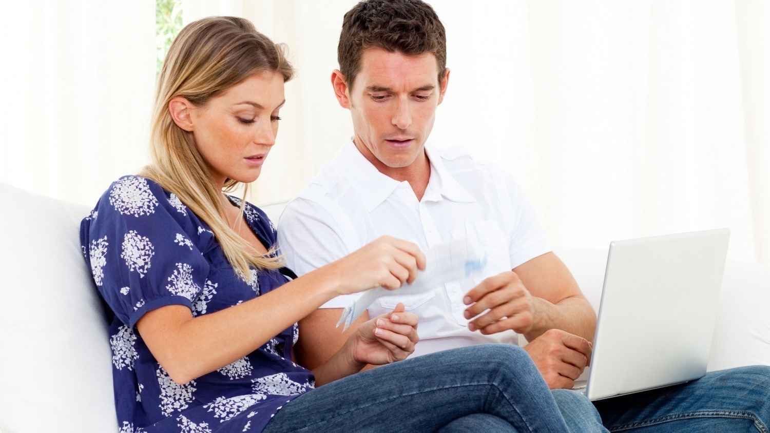 Pessimistic couple stressed with so many bills to pay