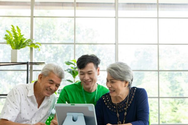 a couple of people that are looking at a tablet