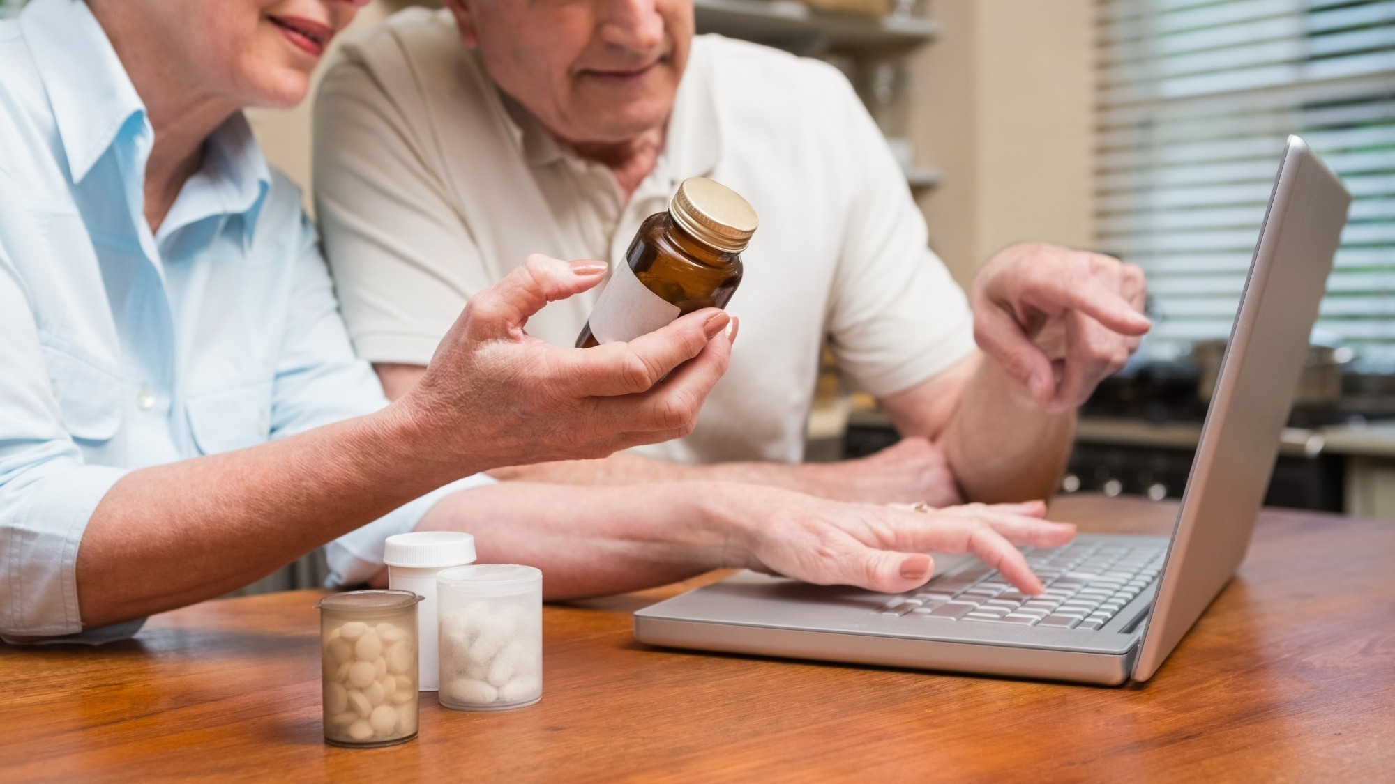 Senior couple looking up medication online