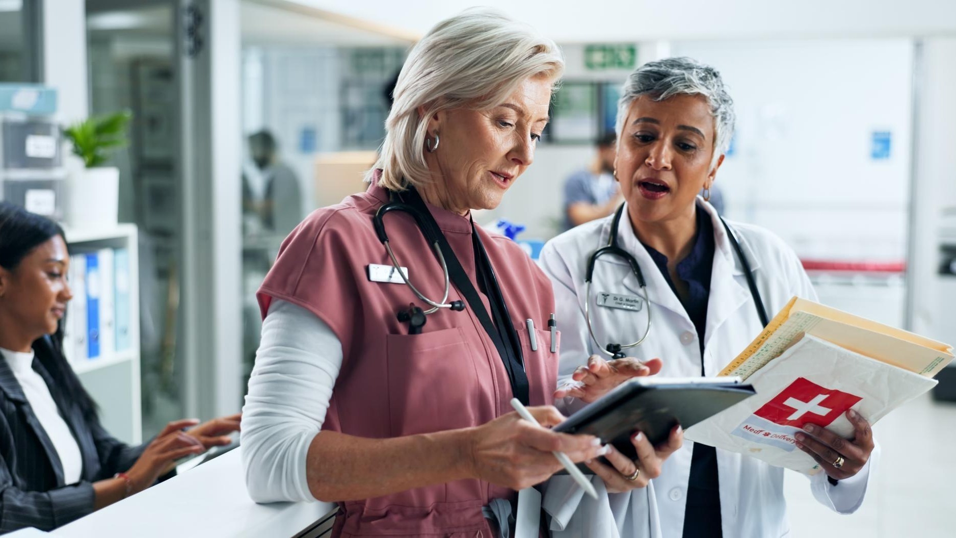 Doctor nurse and women with tablet for hospital management advice and consulting together Healthcare professional and medical team with digital app for online schedule agenda or report in clinic