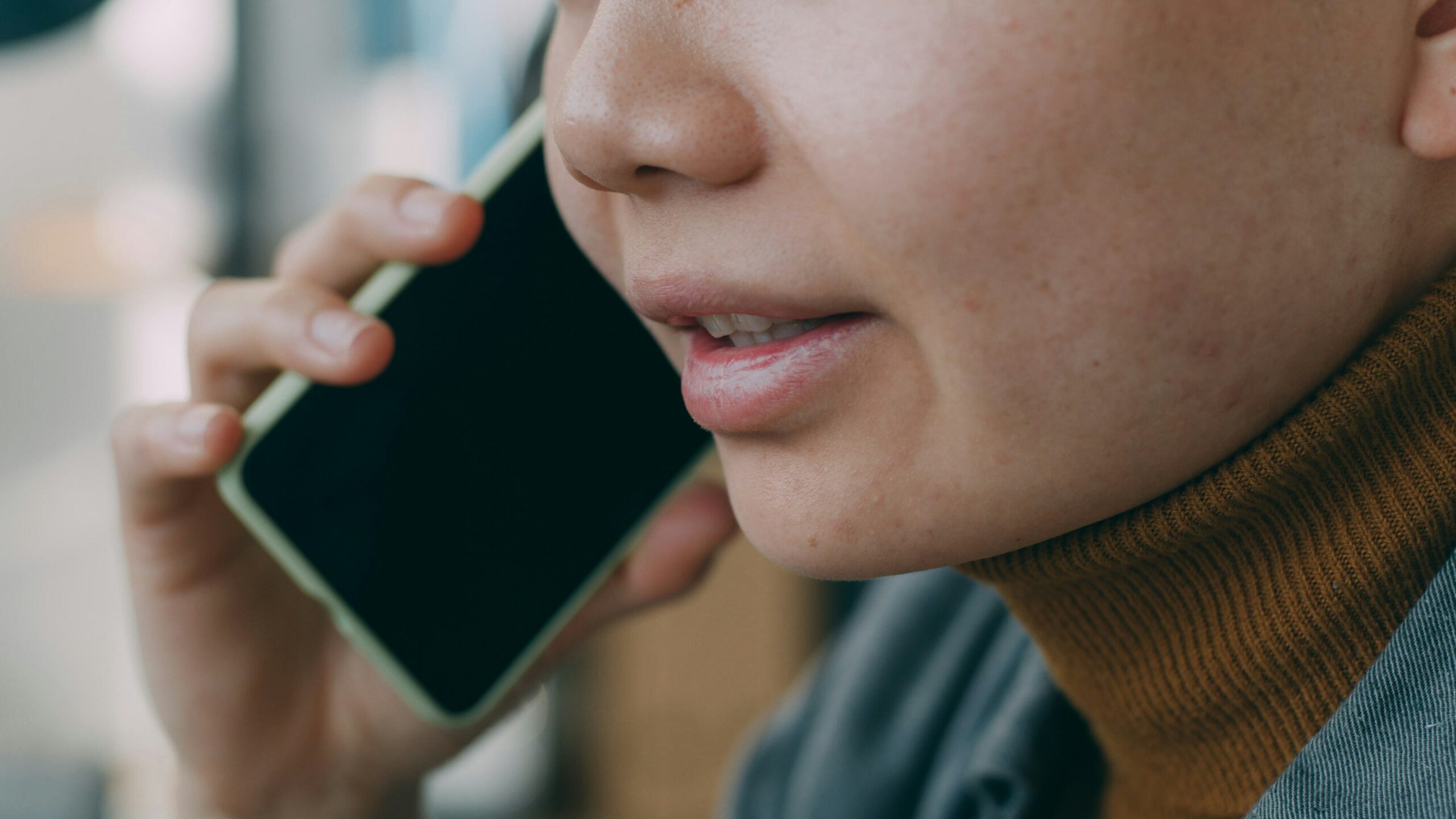 A woman is talking on a cell phone