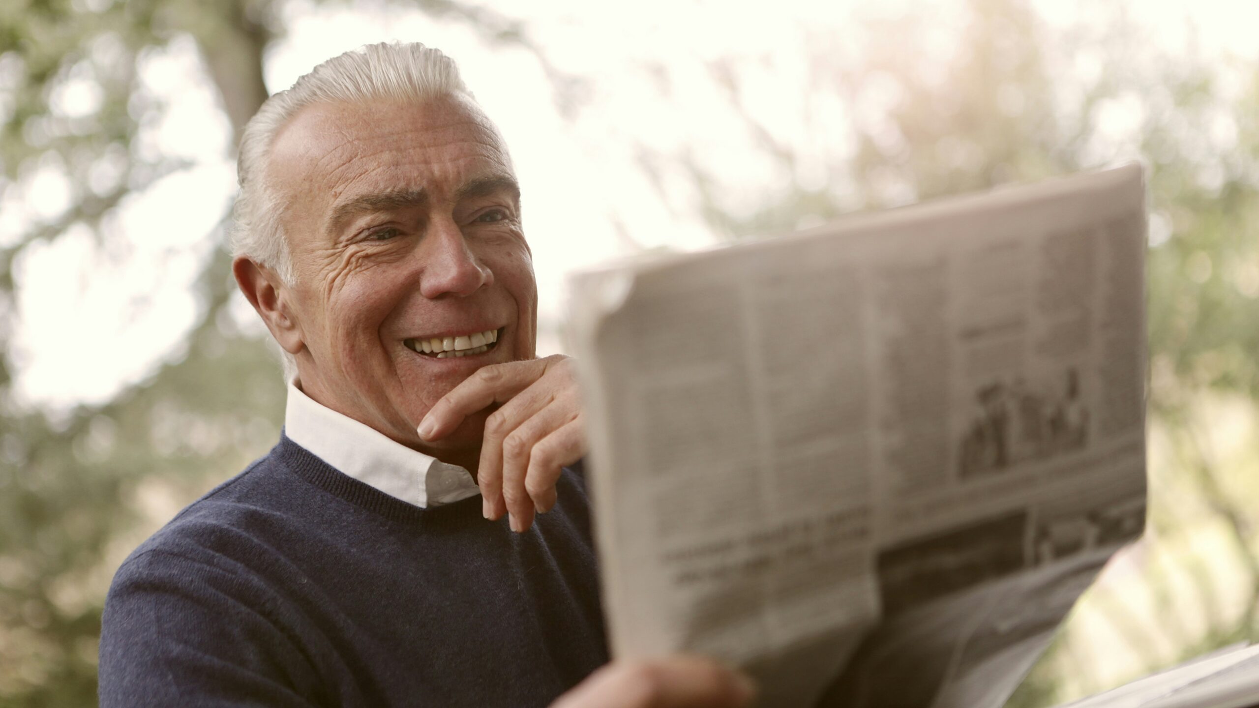 man reading newspaper