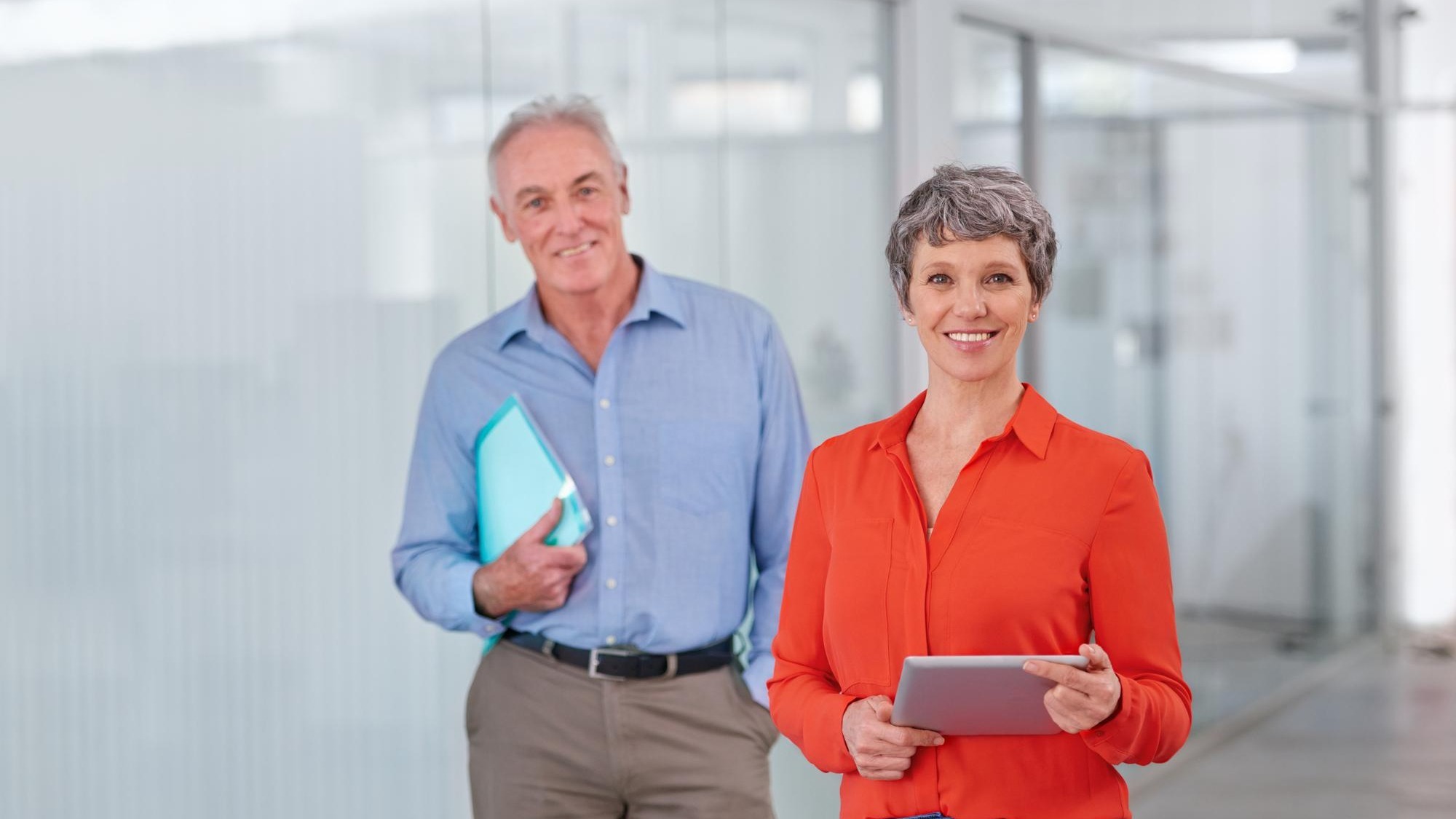 Theyre bringing expert experience to their business Two mature coworkers standing together in the office