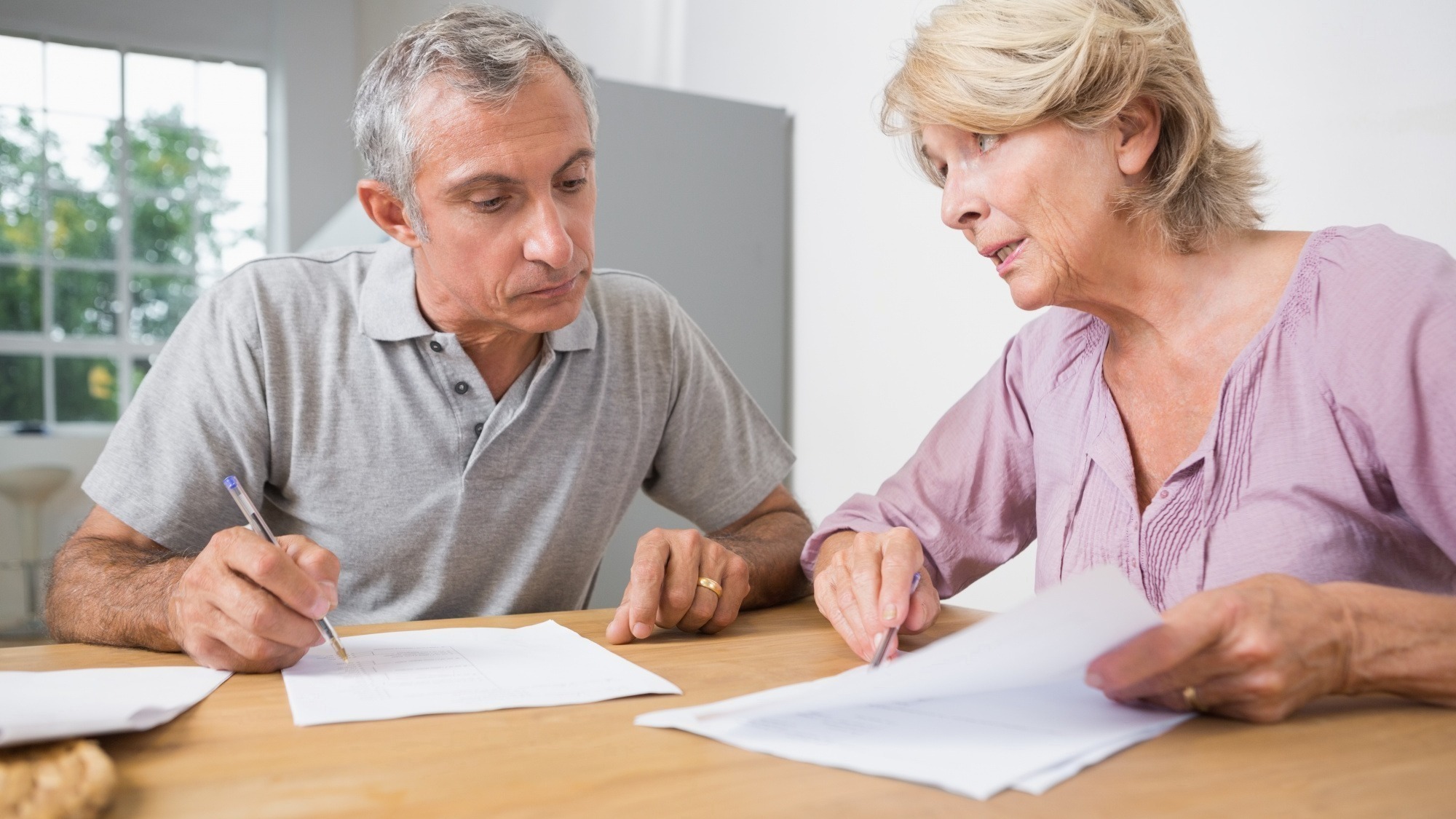 Couple discussing with documents