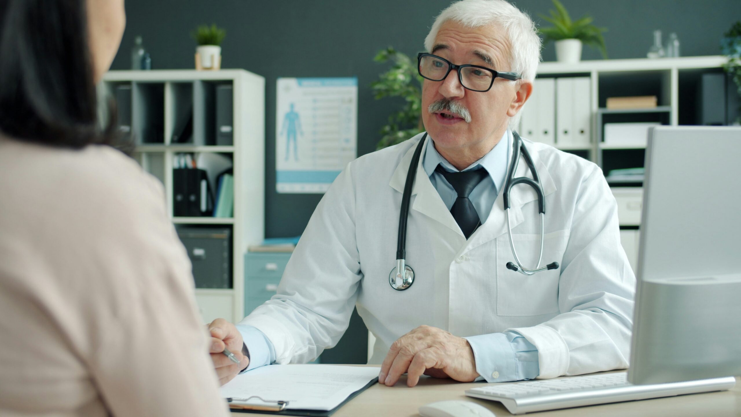 Doctor talking to patient in an office