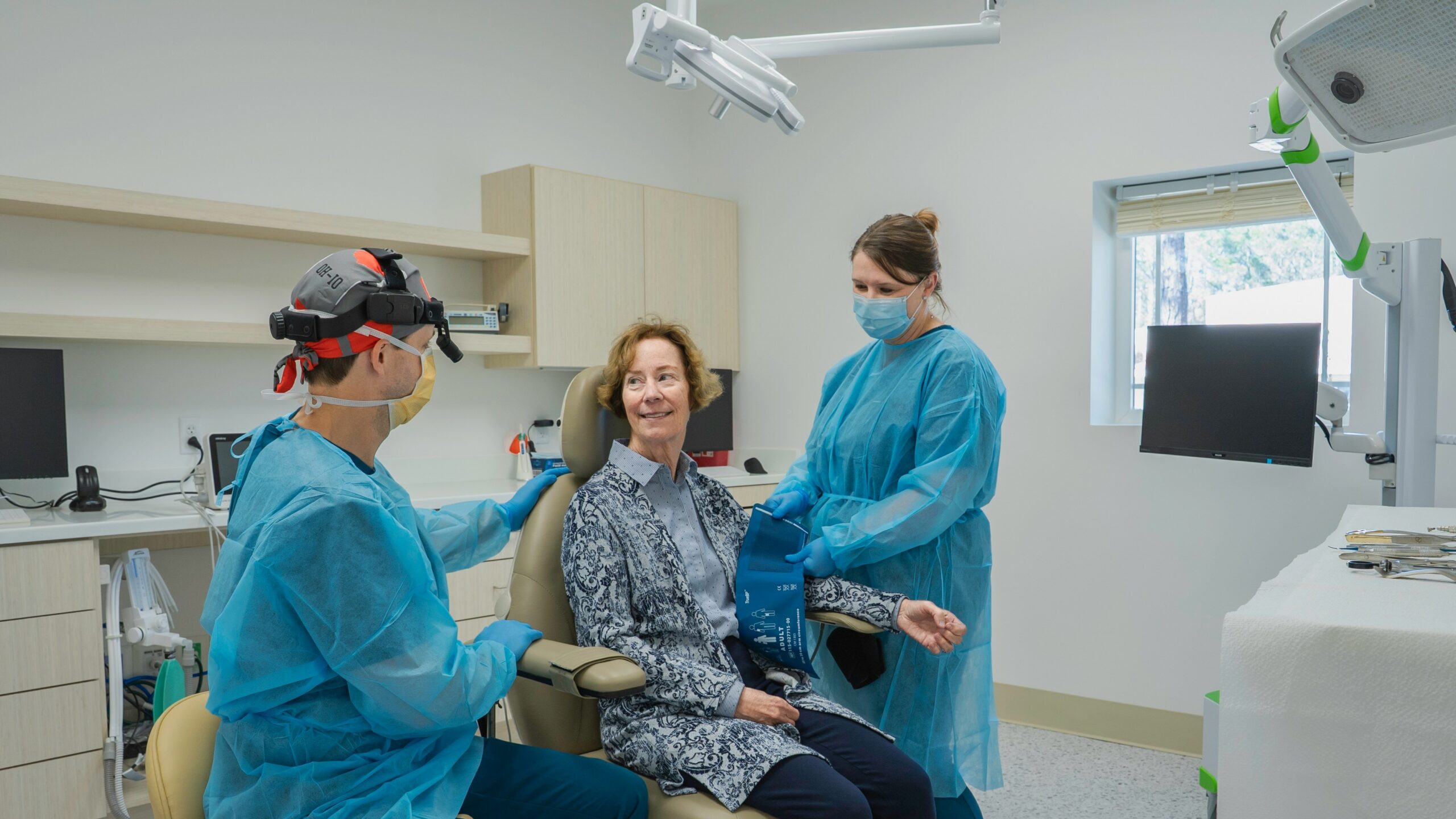A group of people in a dental room