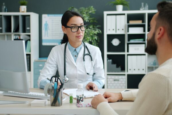 Doctor consults with patient in medical office