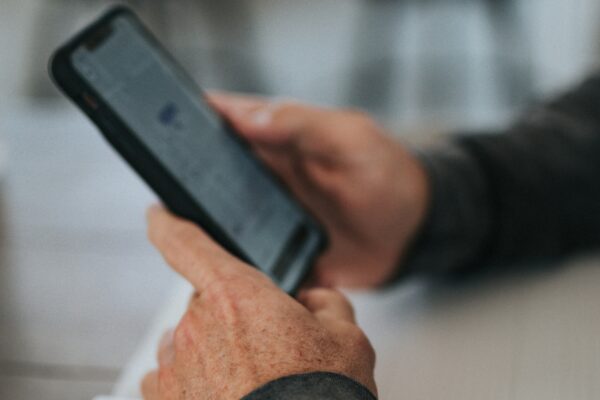 person holding black iphone 5