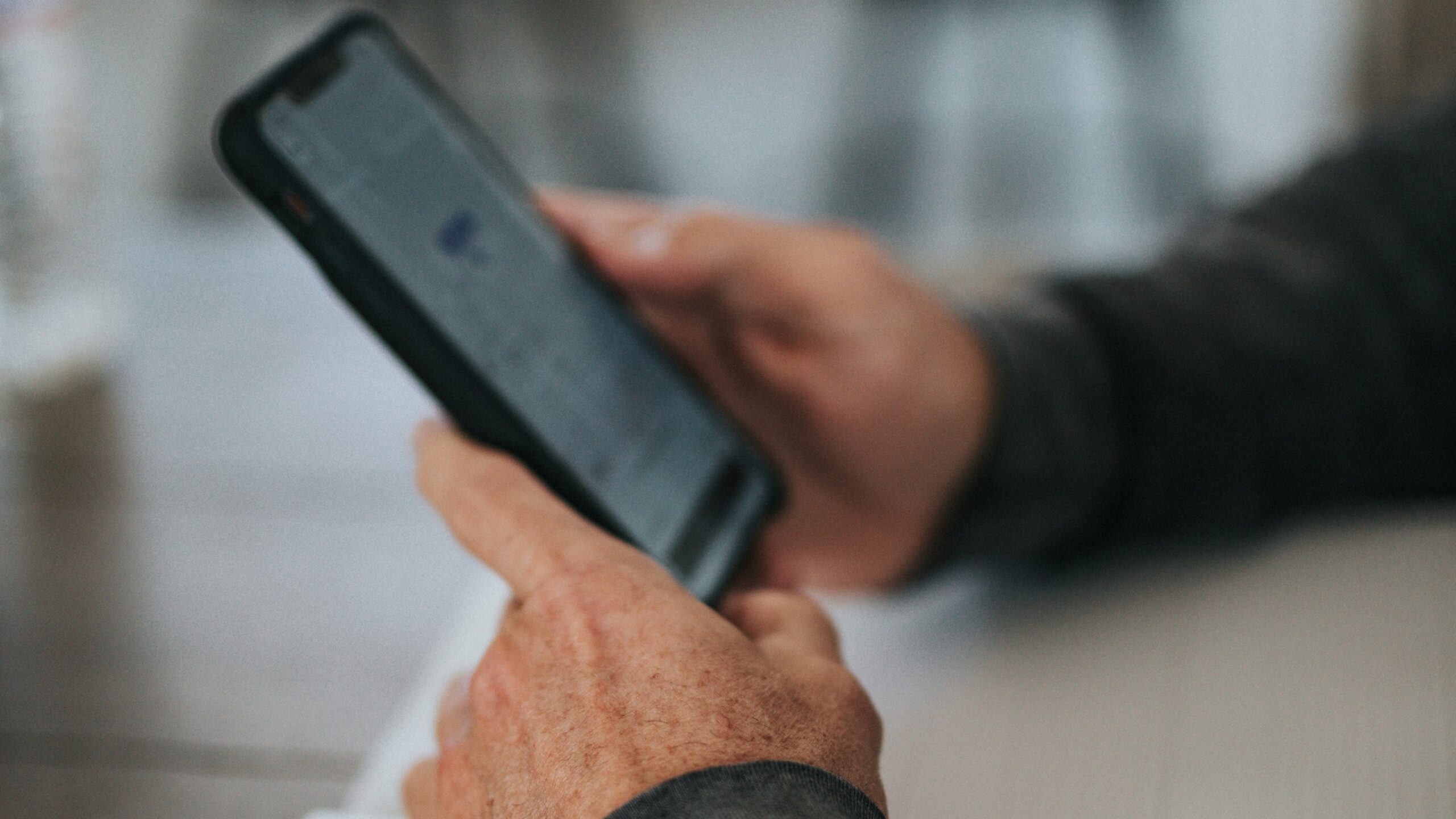 person holding black iphone 5
