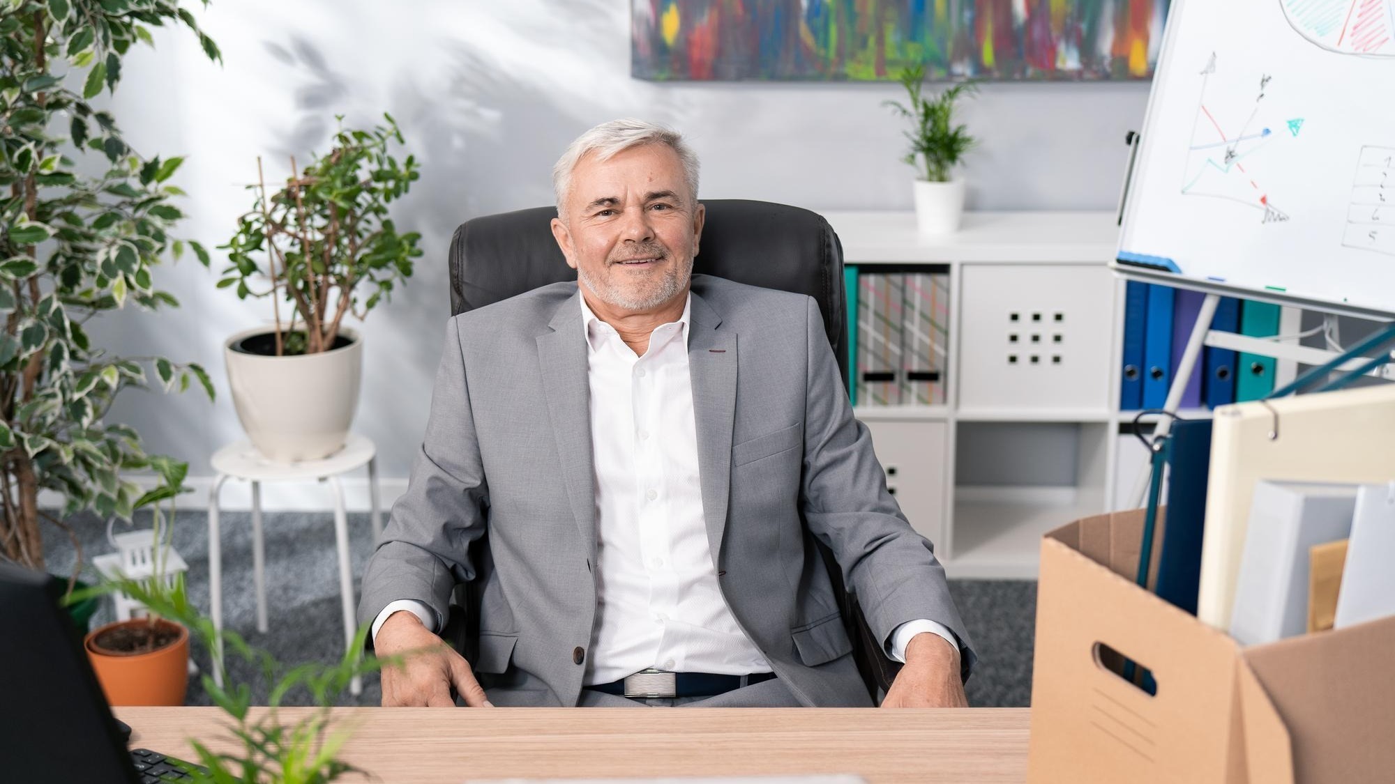 Sympathetic handsome older man boss manager of company