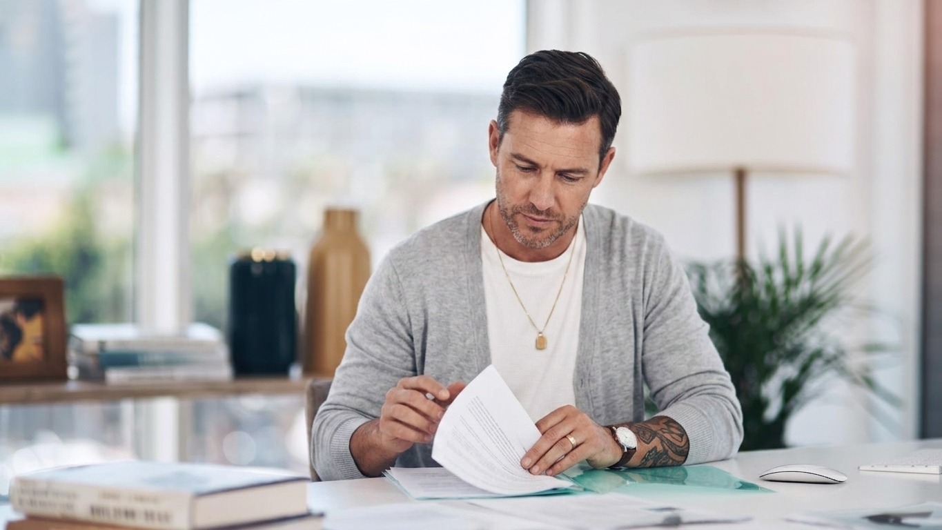 Files reading and woman in office with paperwork administration and checking research report Planning service and consultant at desk with insurance application registration folder or documents