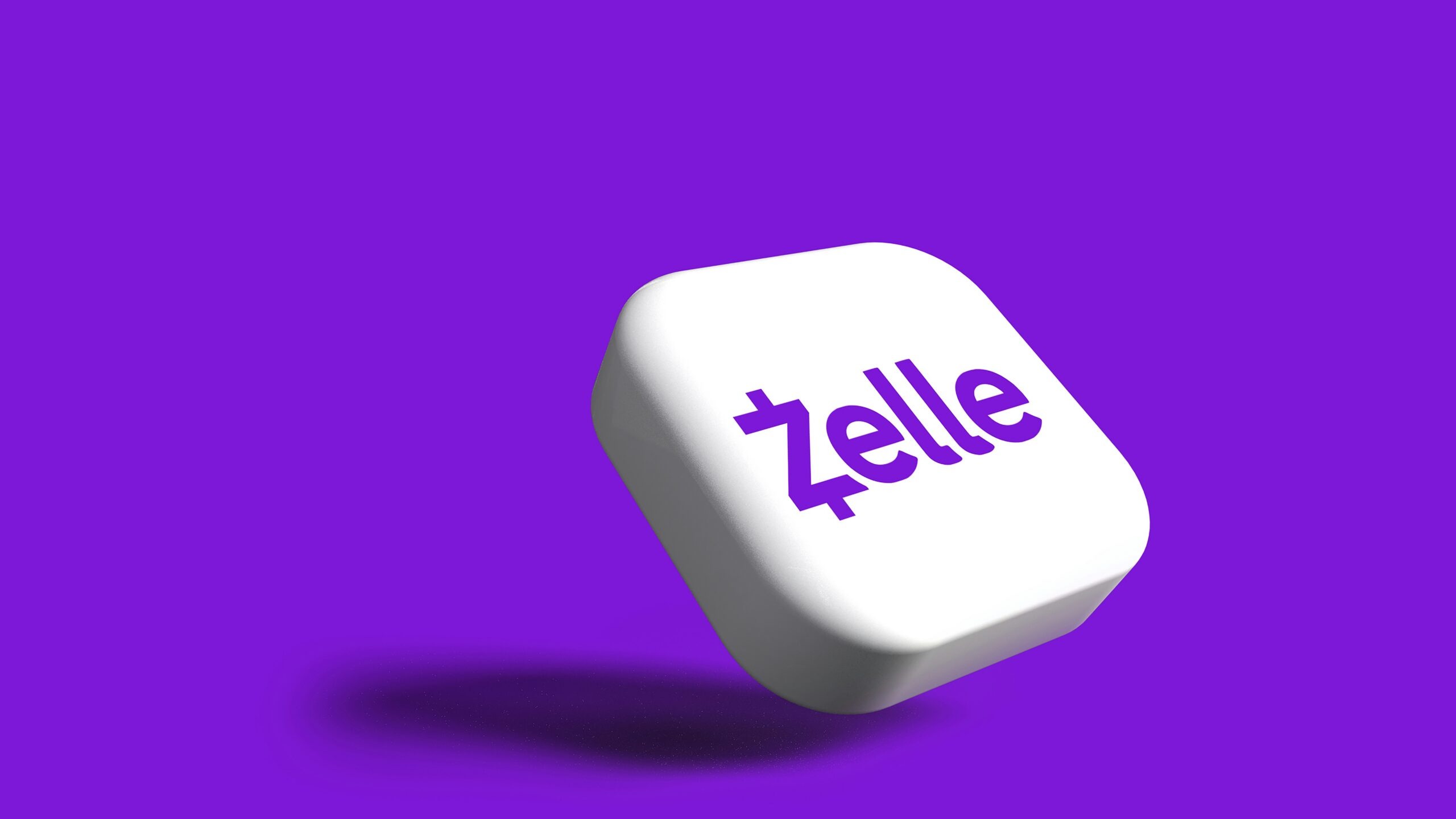 a white dice with the word zelle on it