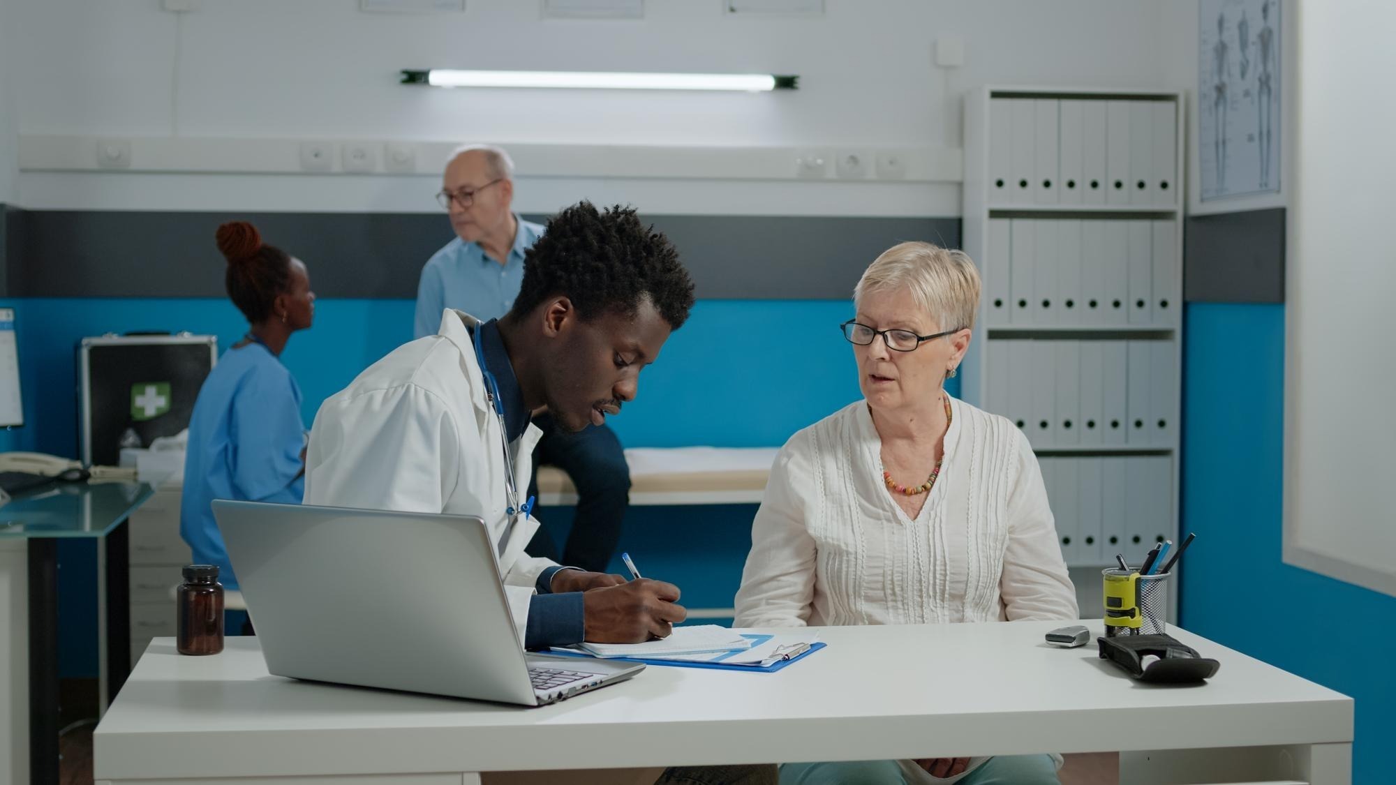 People working on table in office