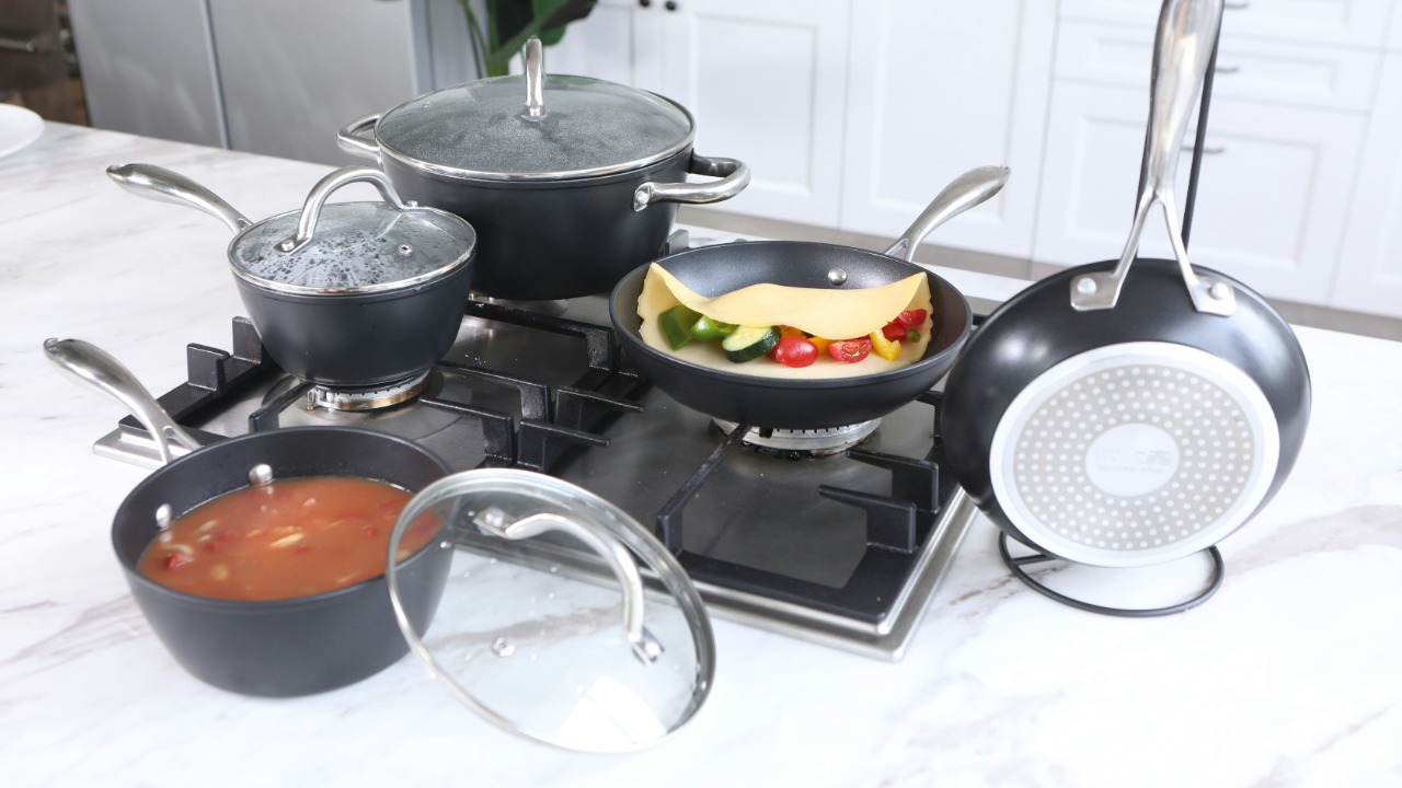 stainless steel cooking pots on stove