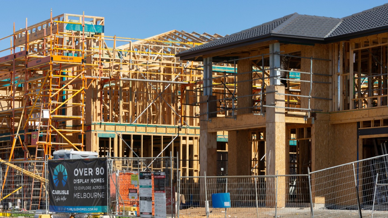 New houses under construction with wooden framing