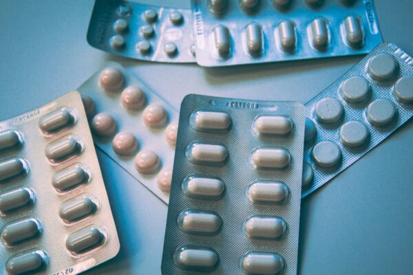 white and blue medication pill blister pack