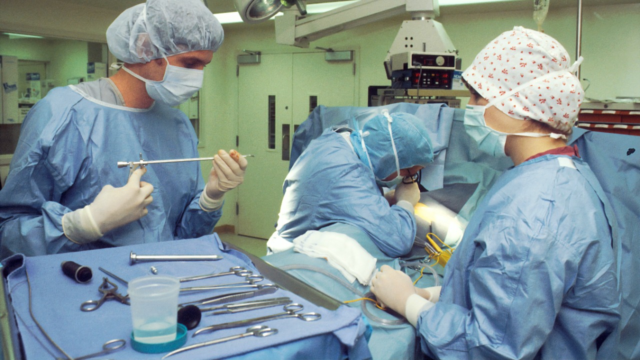 people in blue scrub suit sitting on chair