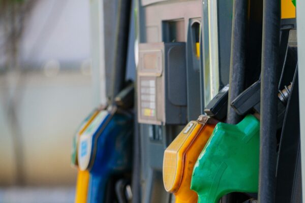 a row of gas pumps filled with gas