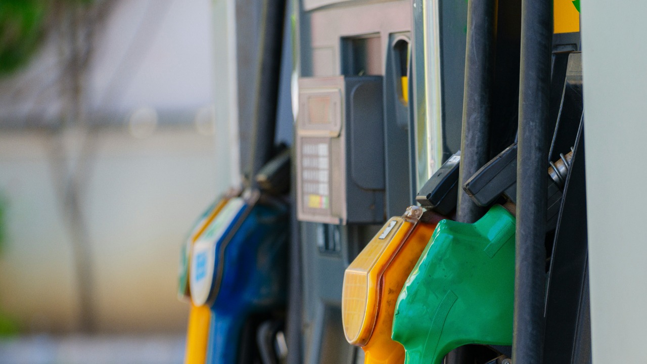 a row of gas pumps filled with gas