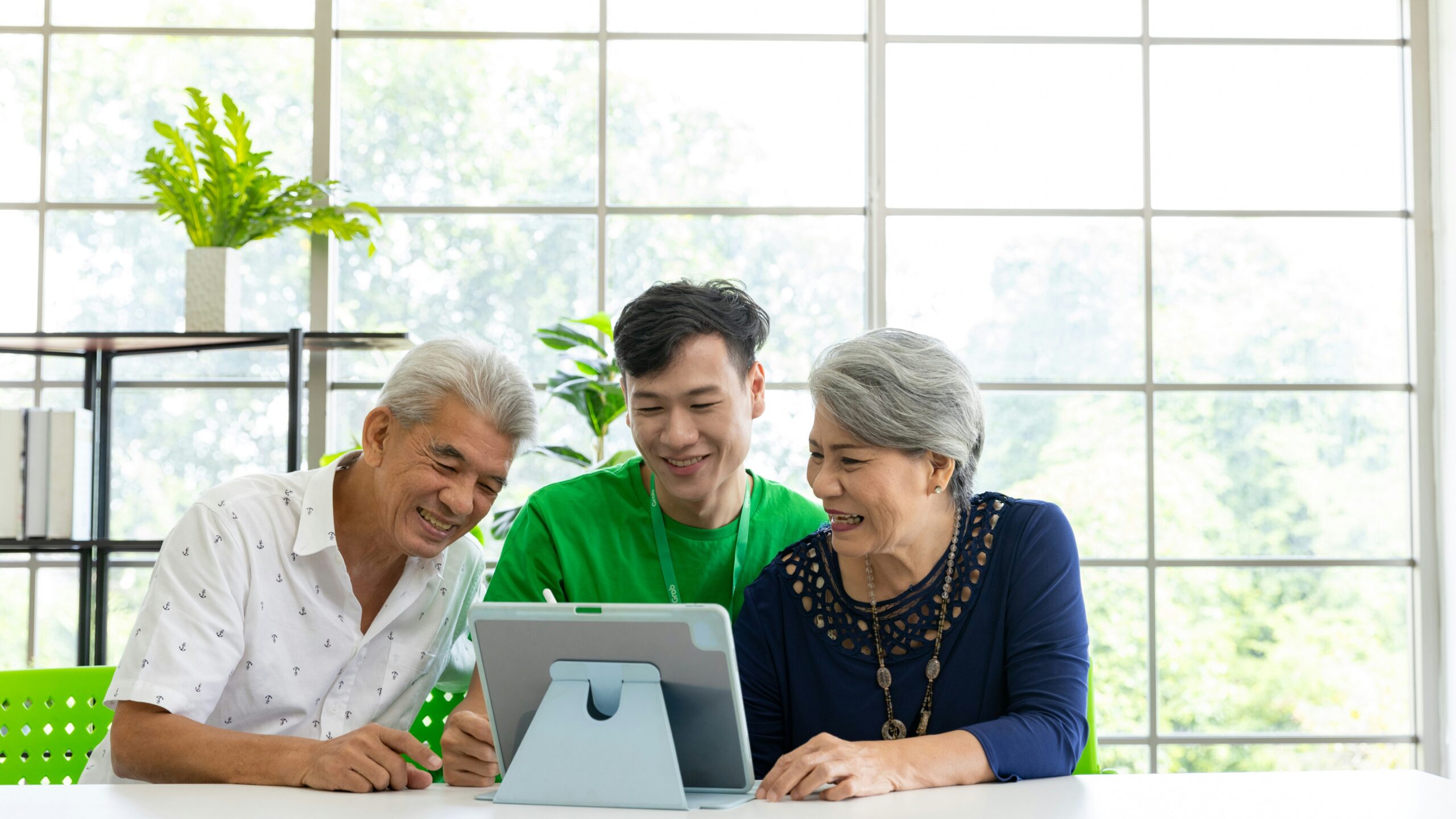 a couple of people that are looking at a tablet