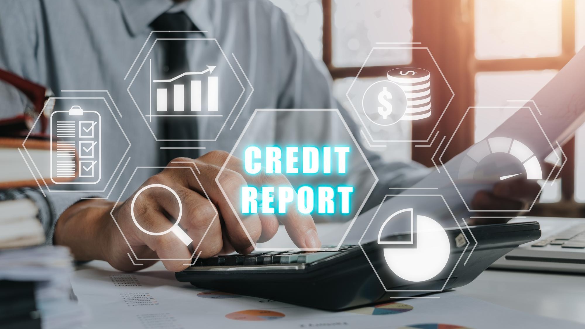 Credit report concept Businessman using calculator and analyzing business charts
