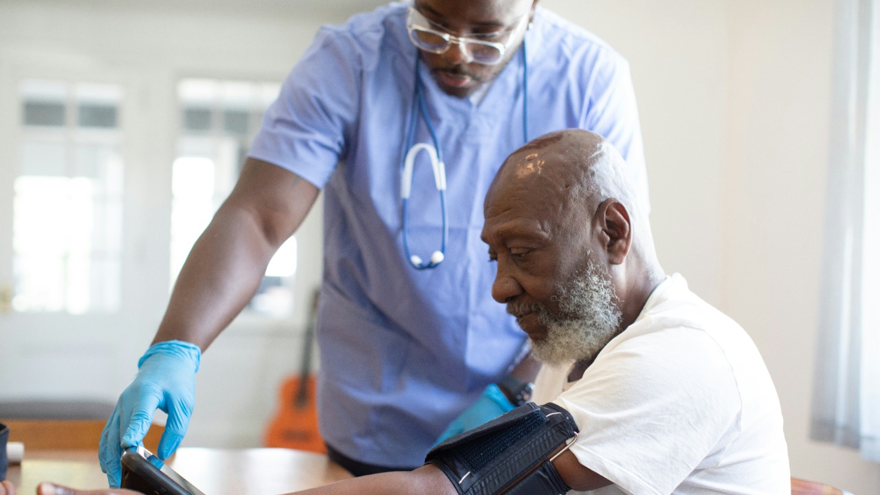 a doctor checking a patient's blood pressure