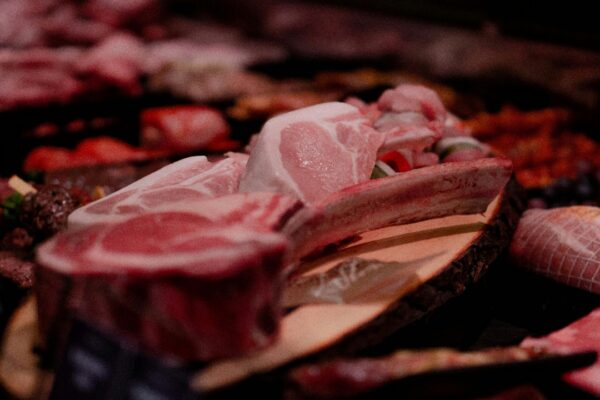 raw meat on brown wooden tray