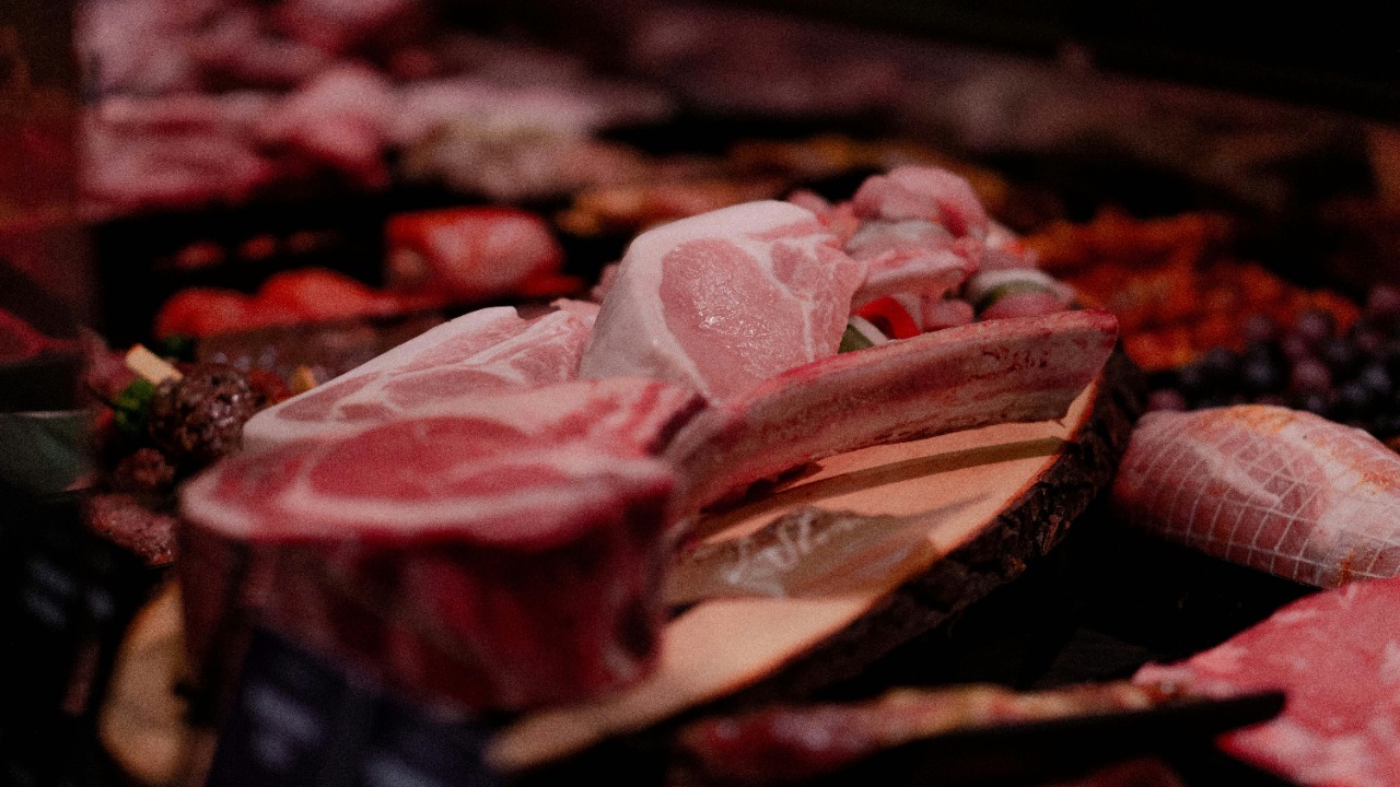 raw meat on brown wooden tray