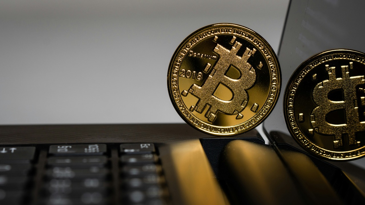 two gold Bitcoins