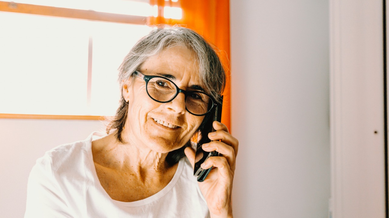 woman in white scoop neck shirt wearing black framed eyeglasses