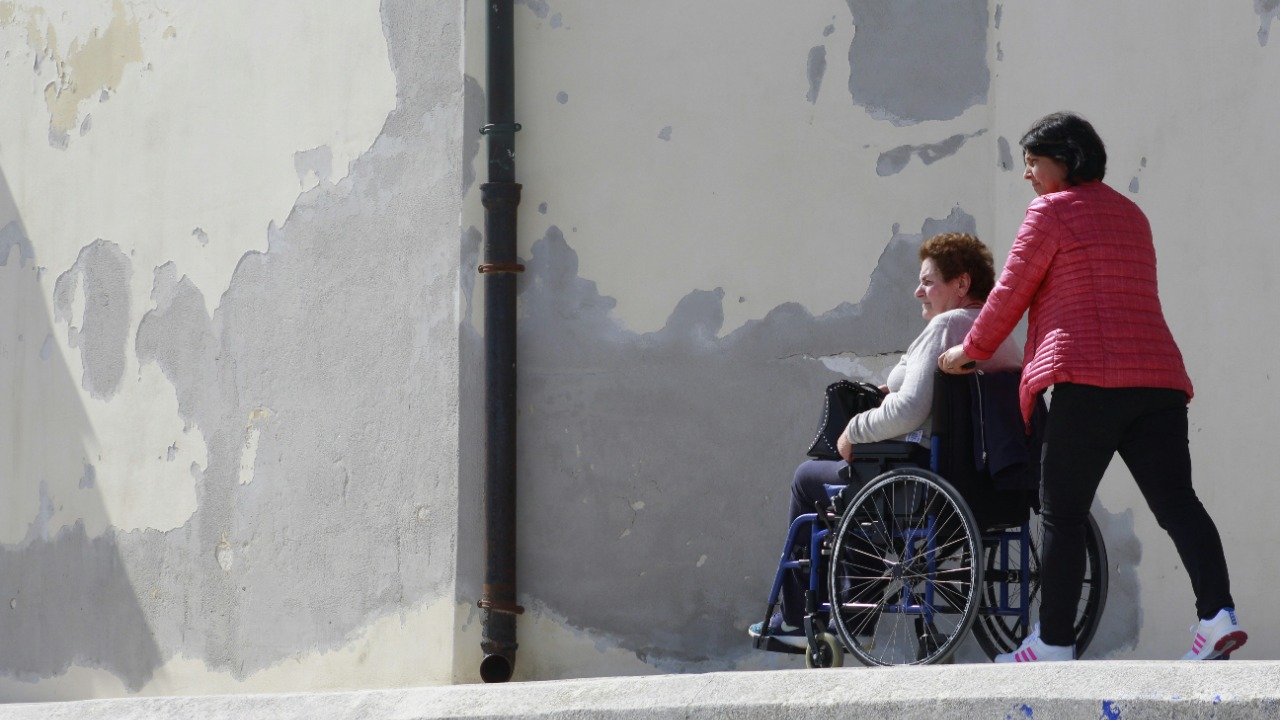 woman sitting on gray wheelchair