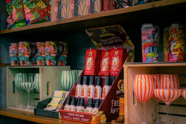 Shelves display colorful items and glassware