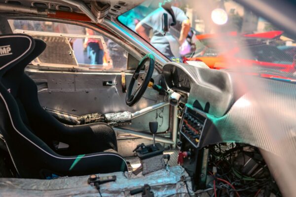 The inside of a car with a steering wheel
