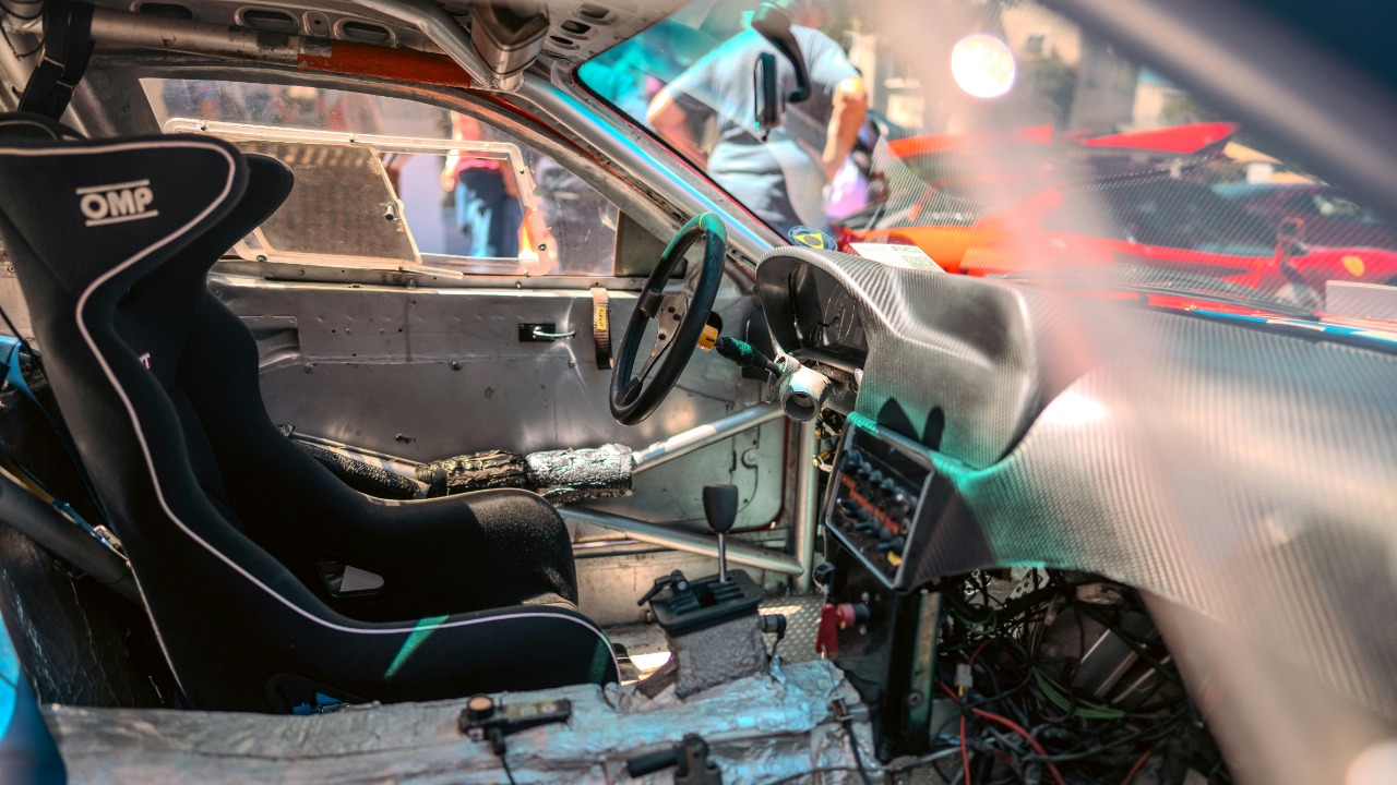 The inside of a car with a steering wheel