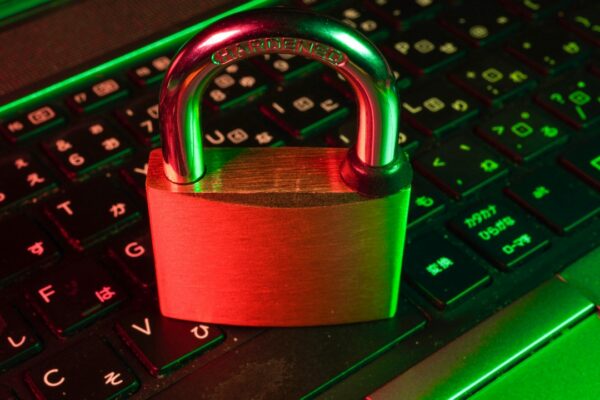 red padlock on black computer keyboard